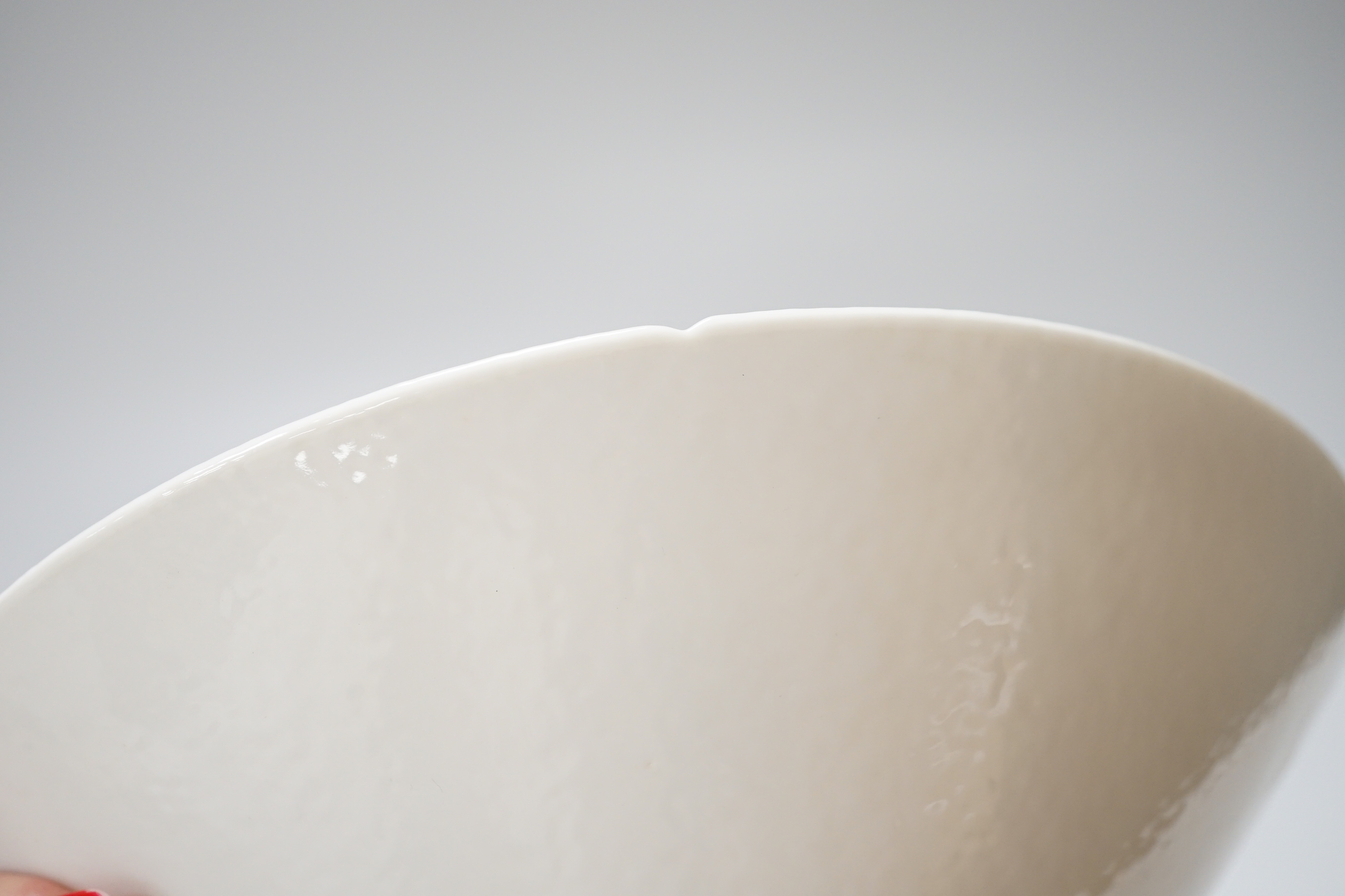 A Chinese white Anhua decorated conical dish, 20cm